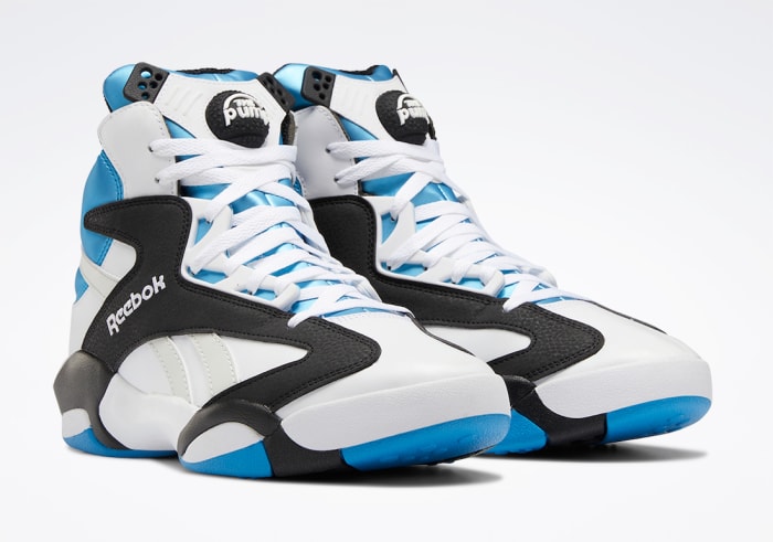 White, black, and blue Reebok Shaq shoes.